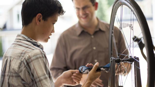 father-son-repairing-bicycle-1018904-wallpaper.jpg